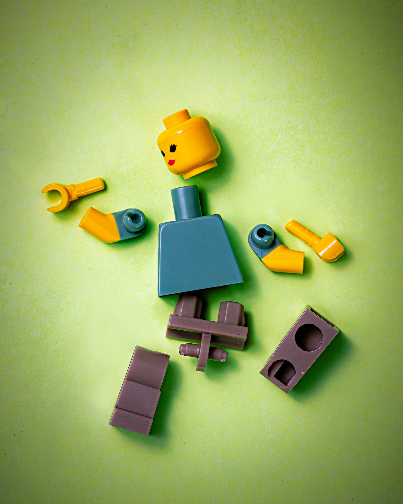 Unassembled Lego pieces to make human.